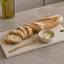 Composiet tapasplank voor stokbrood en kruidenboter